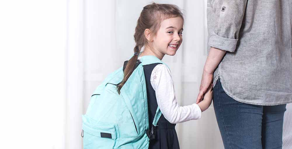Parent and primary school student go hand in hand